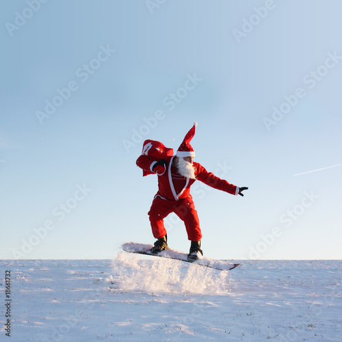 Photo: Santa Claus am Nordpol fährt Snowboard Santa Claus am Nordpol fährt Snowboard