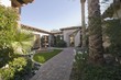 Paved path and water fountain in Palm Springs garden exterior