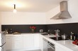 Minimalist kitchen with bare light