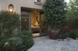 Palm Springs exterior with crazy paving and pot plant