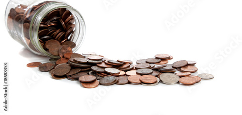 Photo: a Spilt jar of change on white a Spilt jar of change on white