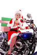 Santas helper on motorcycle delivering gifts Santas helper on motorcycle delivering gifts