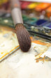 well-used brush in over paintbox