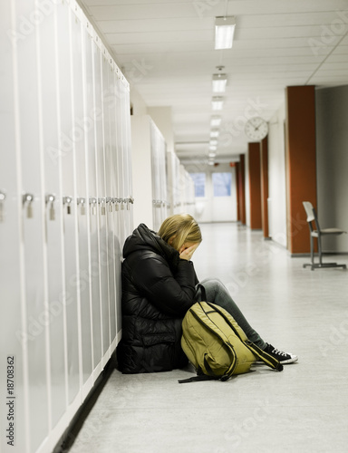 Photo: Young woman getting bullied at school Young woman getting bullied at school