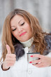 A beautiful caucasian girl drinking hot coffee