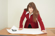 Young woman - engineer works with big drawing Young woman - engineer works with big drawing