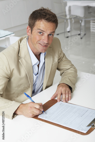 Photo: Businessman signing a contract Businessman signing a contract