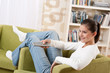 Students - Smiling female teenager watching television