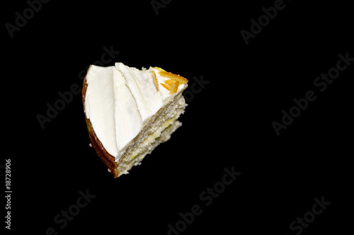 Photo: Cake slice on black background Cake slice on black background