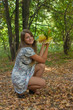 Young pretty woman with the autumn leaf