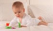 Baby playing with pegs