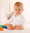 Cute baby playing with bricks