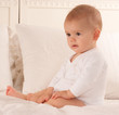 Sitting baby with a bodysuit