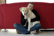 Foto: Young man with his dog (Golden Retriever ) Young man with his dog (Golden Retriever )