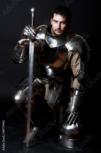 Photo: Great knight holding his sword and helmet Great knight holding his sword and helmet
