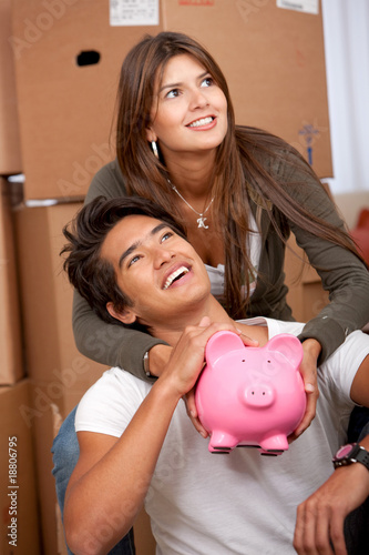Photo: Couple with piggybank Couple with piggybank