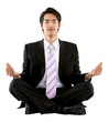 Business man doing yoga