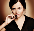 Photo: portrait of beautiful woman with a chocolate portrait of beautiful woman with a chocolate