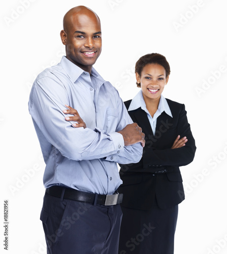 Foto: Young business man with a colleagues at the back Young business man with a colleagues at the back