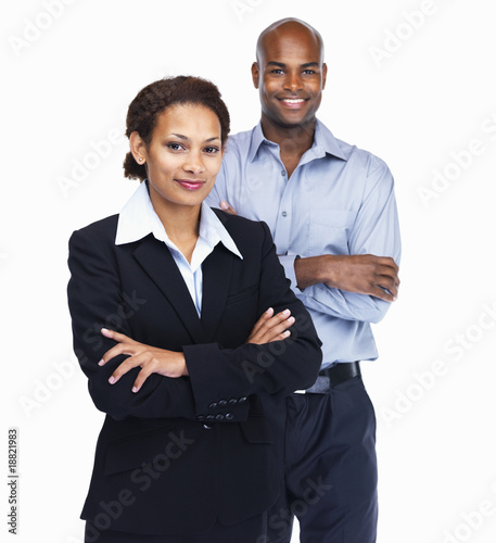 Foto: Pretty business woman with a colleague at the back Pretty business woman with a colleague at the back