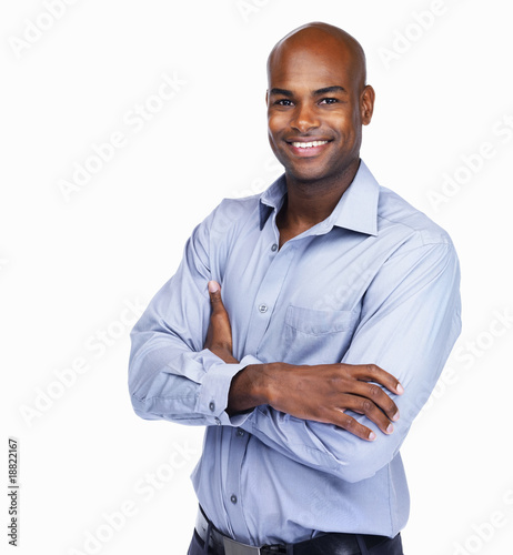 Foto: Smiling confident business man isolated on white Smiling confident business man isolated on white