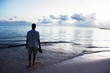young man and sunset on Caribbean sea young man and sunset on Caribbean sea
