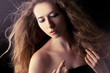 beautiful blond woman applying perfume on her body beautiful blond woman applying perfume on her body