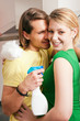 Photo: Couple in doing chores Couple in doing chores