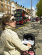 Mother Pushing Baby Carriage