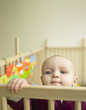 Baby Looking Out of Playpen