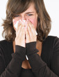 Young Woman Blowing Nose