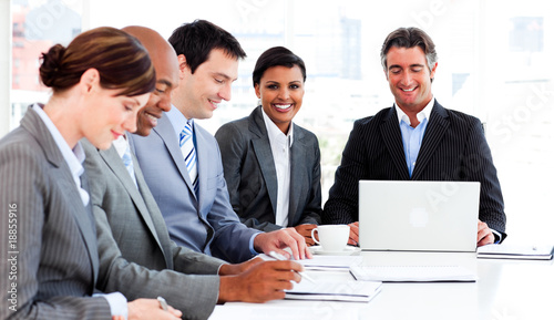 Photo: Multi-ethnic business group discussing a new strategy Multi-ethnic business group discussing a new strategy