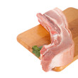 Fresh pork meat on wooden board with parsley