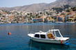 Historical houses and small boat on symi island