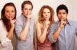 Secretive group with finger on lips