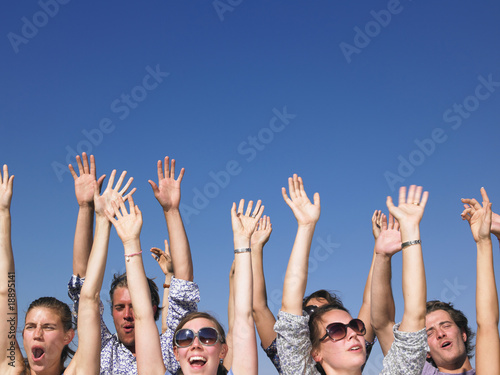 Photo: Enthusiastic People with Arms Raised Enthusiastic People with Arms Raised