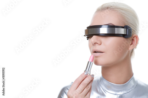 Beautiful cyber woman applying make-up ....