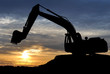 Loader excavator over sunset