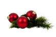 Red Christmas ornaments/baubles with pine branch on white