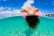 woman floating in tropical water