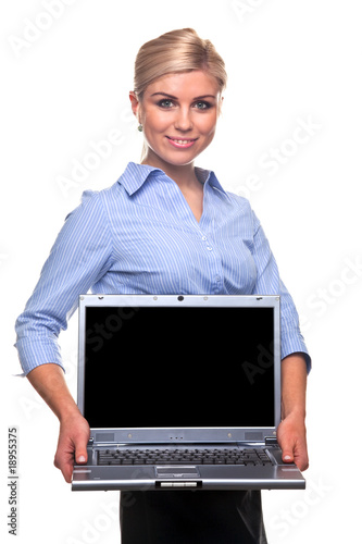 Blond busineswoman holding a laptop with copy space