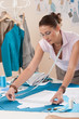 Female fashion designer working at studio