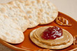 Sweet strawberry jelly and peanut butter on a cracker Sweet strawberry jelly and peanut butter on a cracker