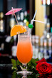 Fresh iced cocktail and red rose.