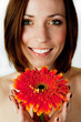 Beautiful young woman with gerbera flower isolated Beautiful young woman with gerbera flower isolated