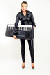 punk rock fashion girl holding a piano keyboard punk rock fashion girl holding a piano keyboard