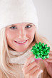 Young happy winter woman with red christmas present