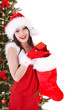 Christmas girl in santa hat,  sock, tree with  gift box.