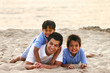Father & two sons on the beach