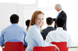 Foto: Smiling caucasian businesswoman at a conference Smiling caucasian businesswoman at a conference